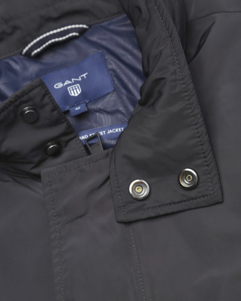Close-up of the Gant GRAND STREET JACKET collar featuring zip and press stud details in Odyssey Grey.