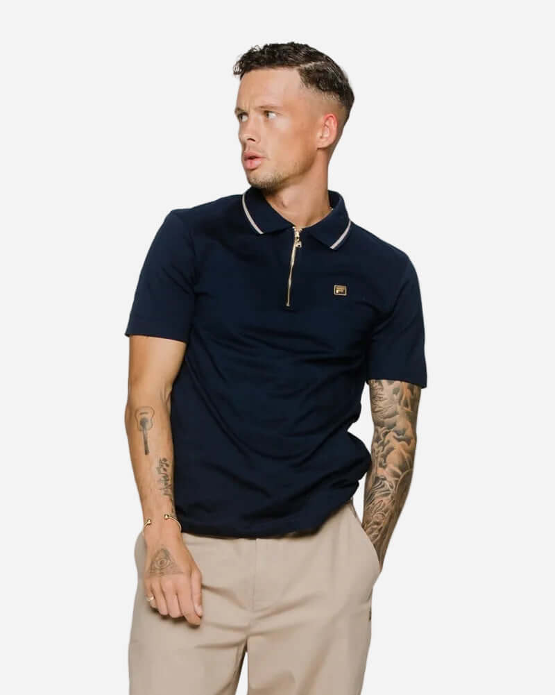 Fila Gold LEMAR 2 Polo Shirt Black modeled by a man, showcasing a refined sportswear style with a relaxed fit.