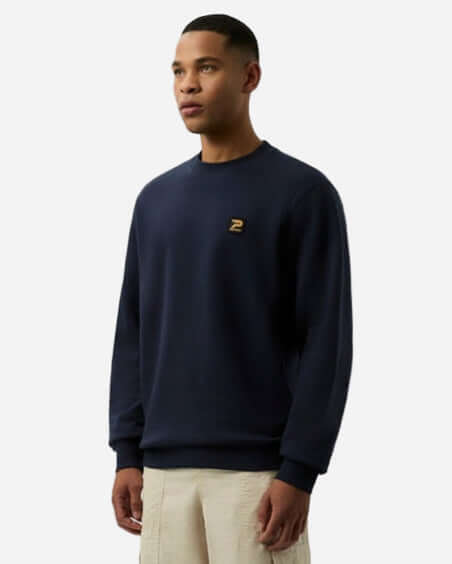 Patrick OSCAR Crew Sweat Top Navy model wearing a comfortable navy sweatshirt with signature detailing
