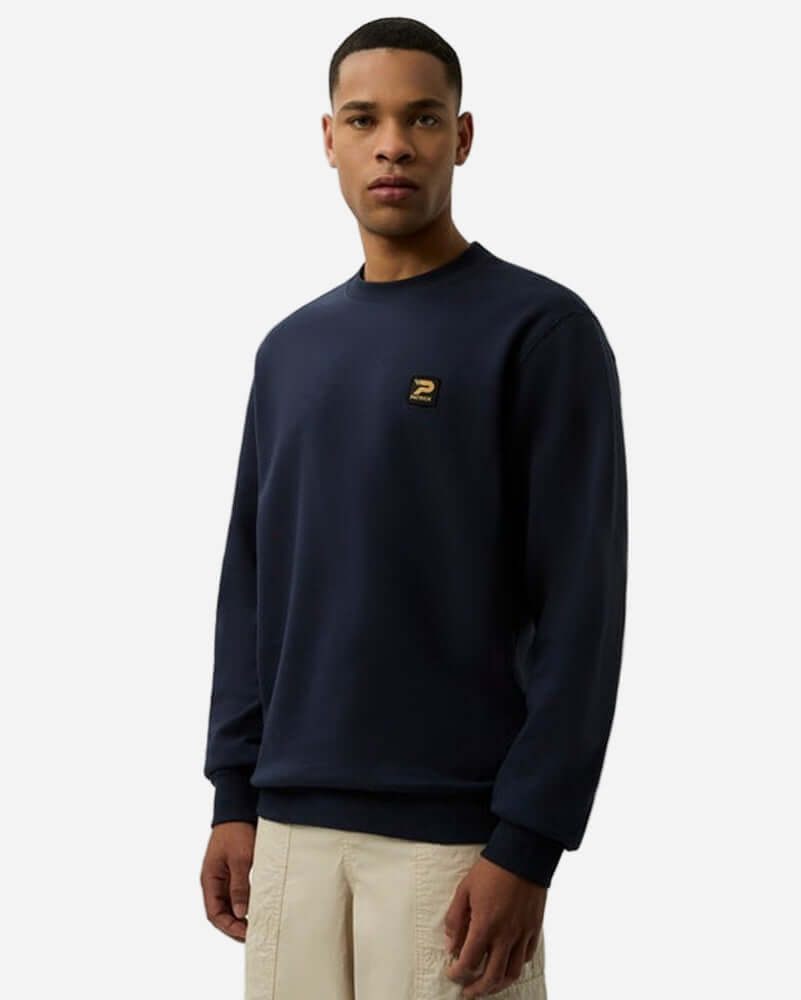 Patrick OSCAR Crew Sweat Top Navy worn by model, featuring ribbed cuffs and subtle signature patch.