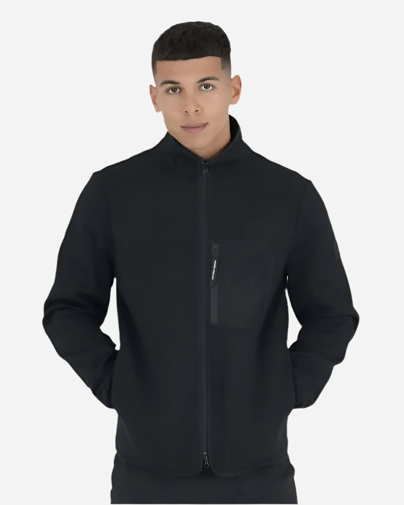 Peaceful Hooligan CONQUEST Jacket Black worn by model, showcasing premium design and pockets for urban style.
