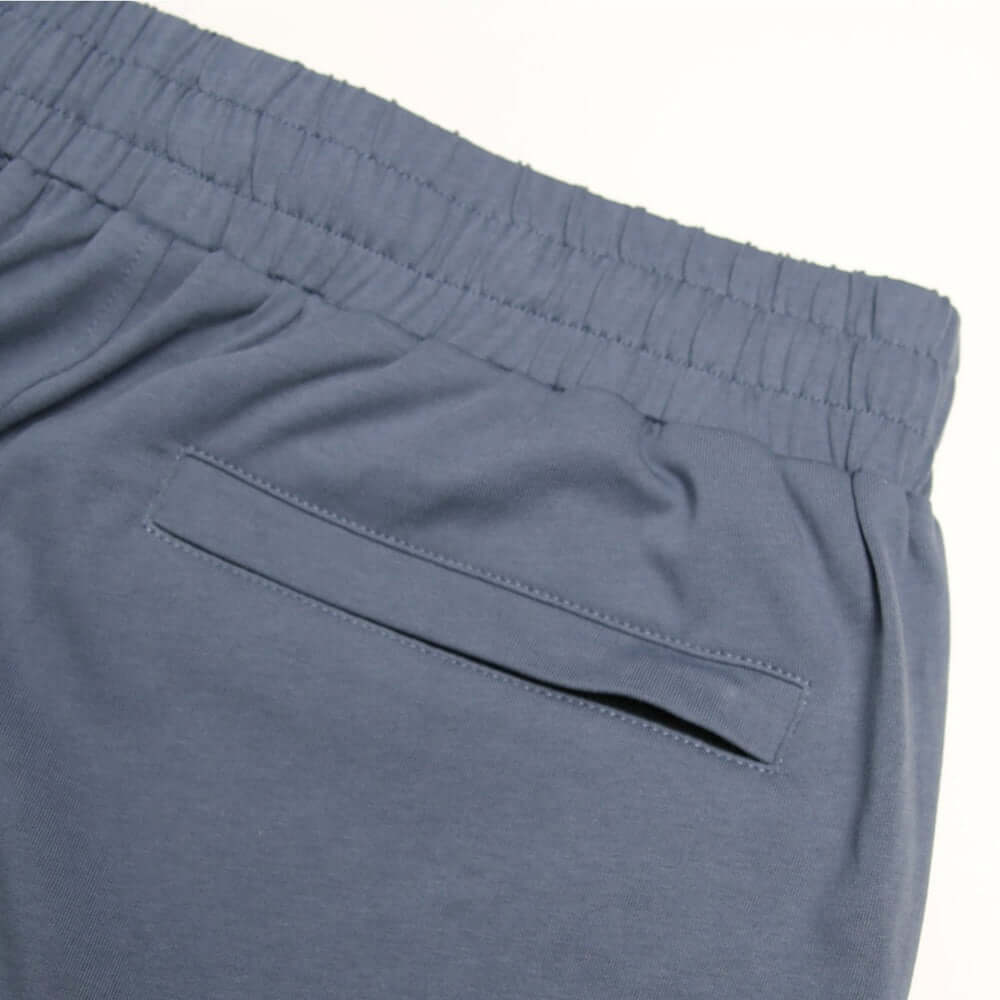 Close-up of the waistband and cargo pocket of Peaceful Hooligan FORGE Shorts in Steel color.