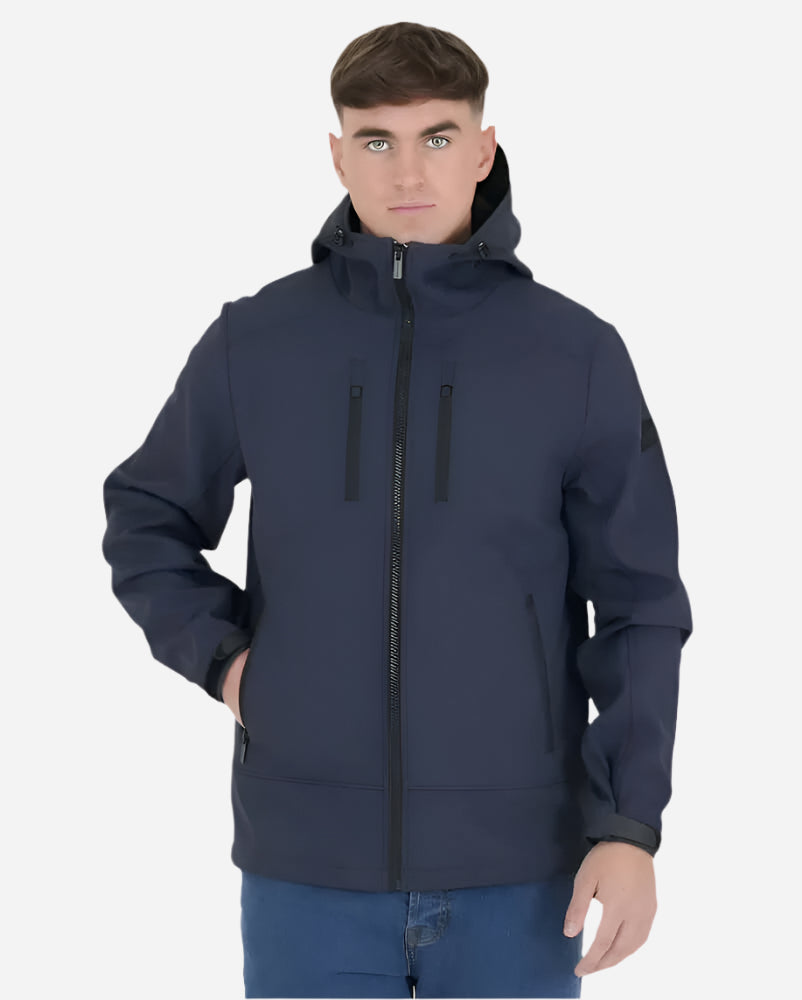 Man wearing the Navy Peaceful Hooligan MARKSMAN Softshell Jacket, showcasing its stylish design and ergonomic features.