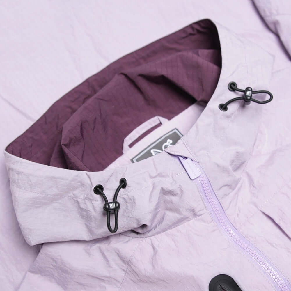 Close-up of the hood detailing and adjustable cords of the Peaceful Hooligan PISTOL Jacket in Lavendula color.