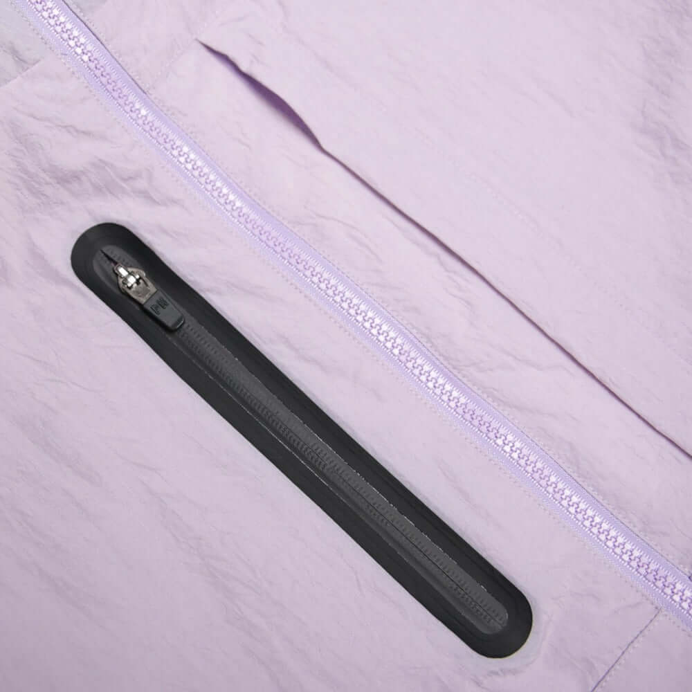 Close-up of the lavender Peaceful Hooligan PISTOL Jacket zipper pocket and fabric texture.