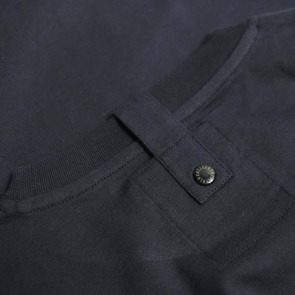 Close-up of the back neck detail of the Peaceful Hooligan ZIZOU T shirt in navy, featuring a snap and tab closure.