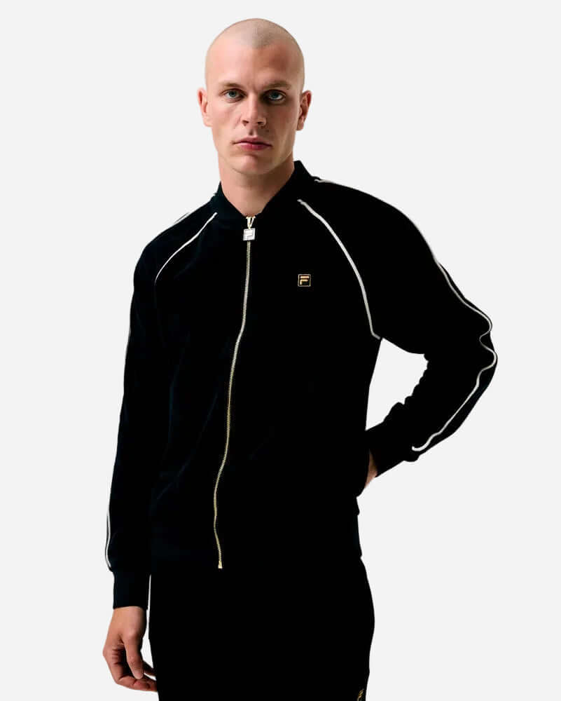 Man wearing Fila FELLA Velour Track Top Black with front zip closure and white piping details.