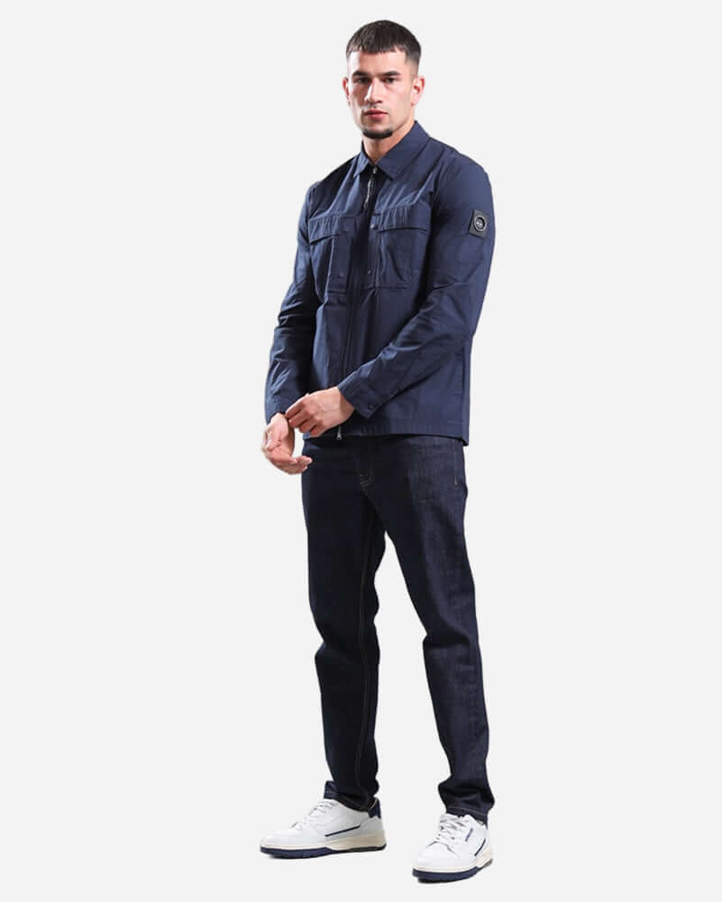 Model wearing Marshall Artist STRATTON Overshirt Navy with dual-entry chest pockets and two-way zip.