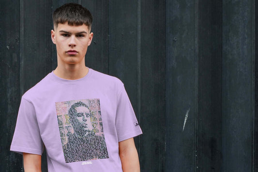 Young man wearing a purple t-shirt with a graphic print, representing the peaceful hooligan spirit.