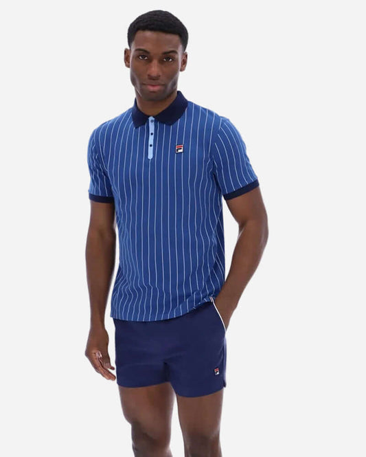 Fila BB1 Polo Limoges worn by a model, featuring a blue striped design with a collar and a casual fit.