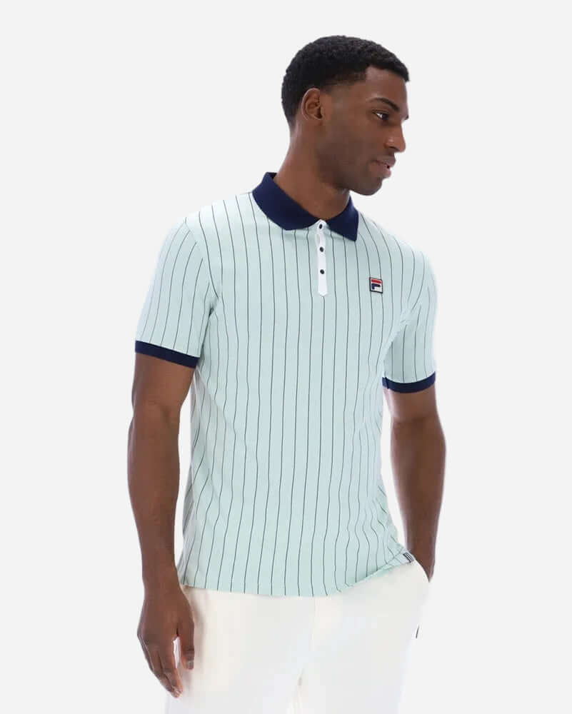 Fila BB1 Polo Surf Spray in surf spray color with navy and white stripes, worn by a model.