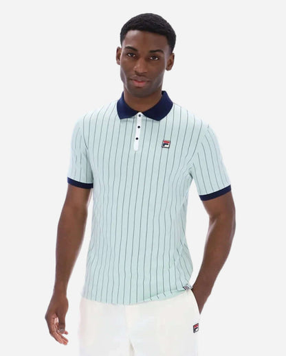 Fila BB1 Polo Surf Spray in Surf Spray/Navy/White on a model, featuring vintage-style stripes and a relaxed fit.