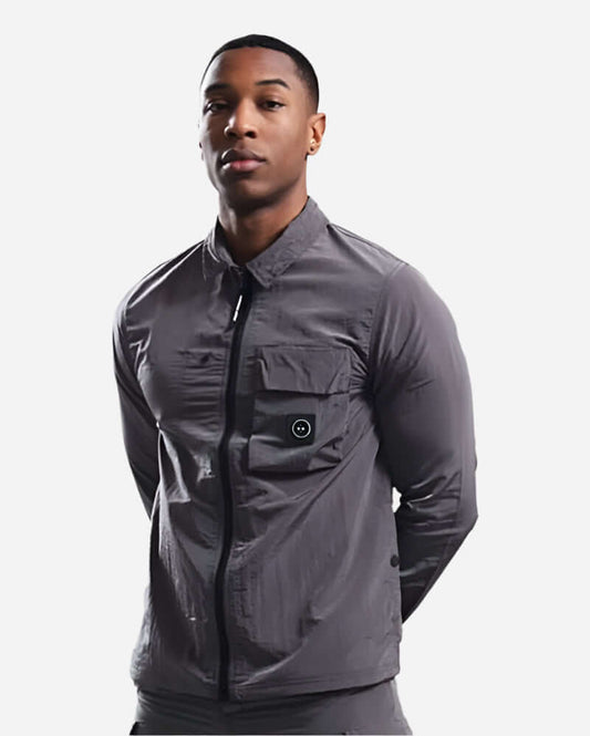 Model wearing Marshall Artist CARICO Overshirt in Volcanic Grey with stylish design and a single velcro pocket.