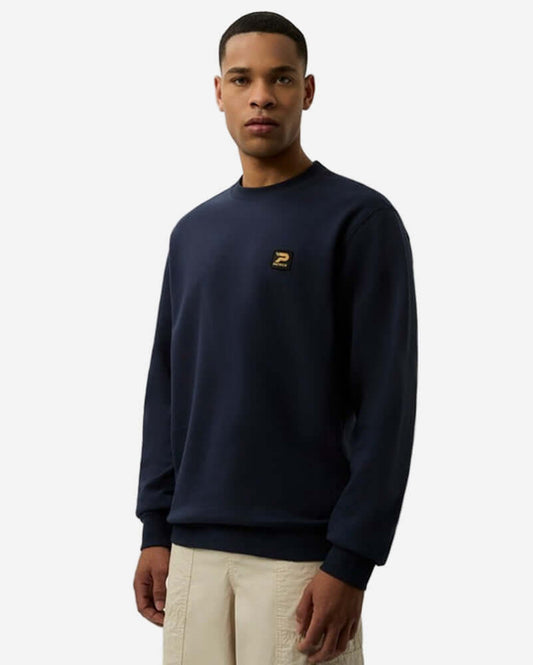 Patrick OSCAR Crew Sweat Top Navy worn by model, featuring ribbed cuffs and subtle signature patch.