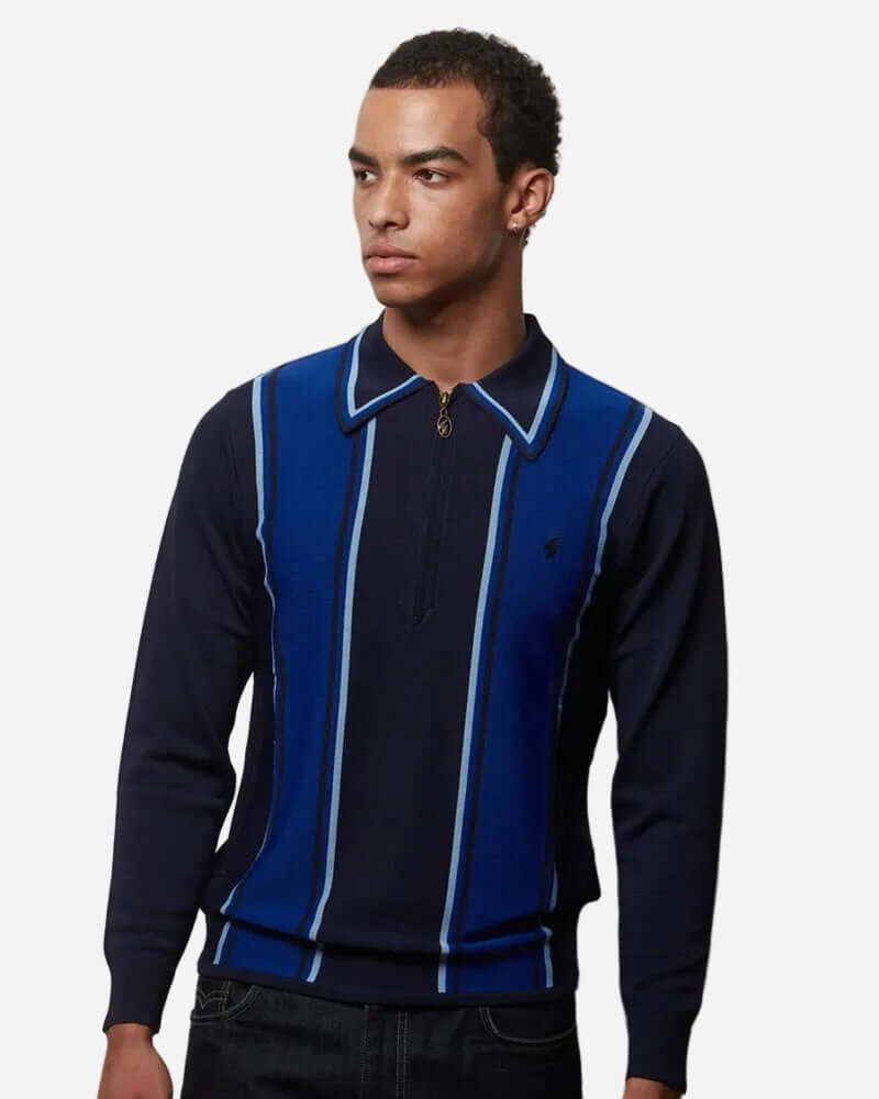 Man wearing Gabicci XANDER Knit Polo Navy with a zip placket and contrast stripes, showcasing classic style.