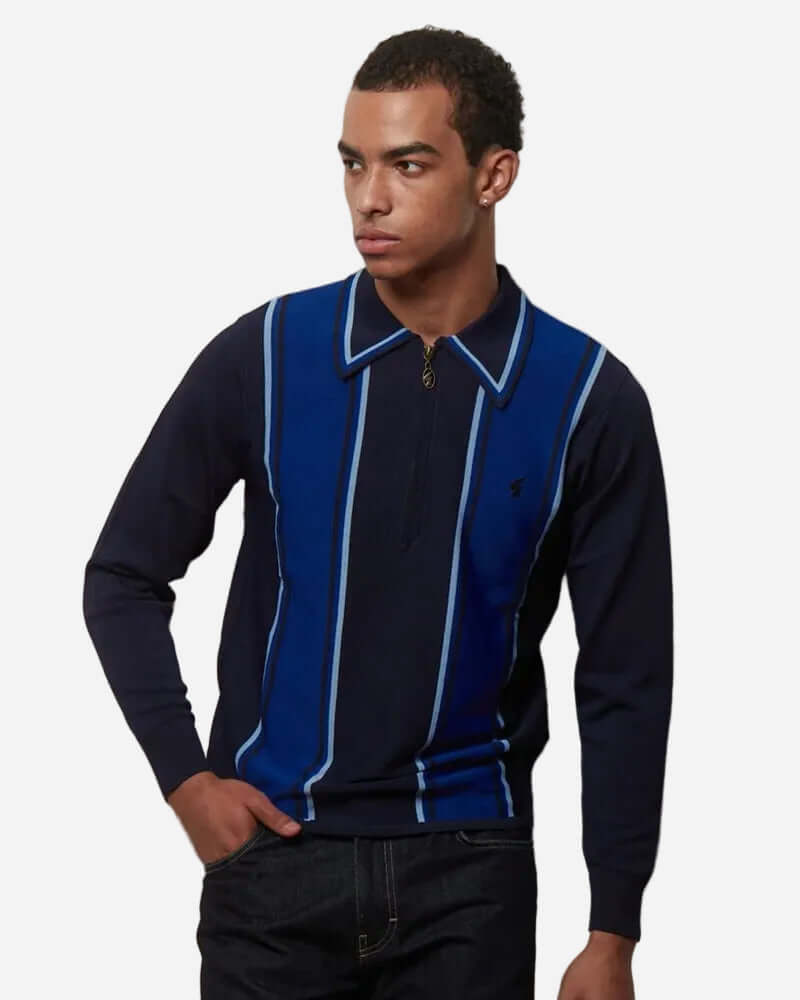 Gabicci XANDER Knit Polo Navy displayed on a model, featuring long sleeves and contrast stripes for a stylish look.