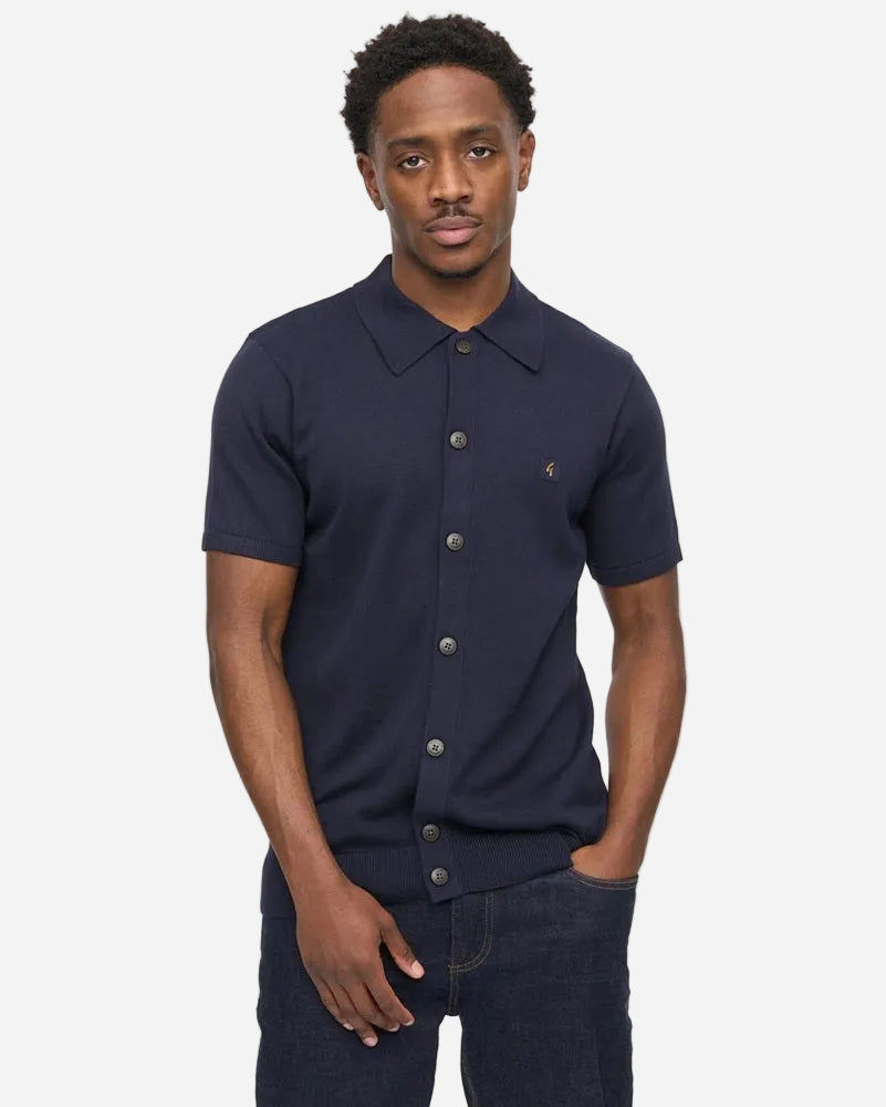 Gabicci GUINESS Button-Through Polo Navy worn by model, showcasing style and comfort with its classic design.
