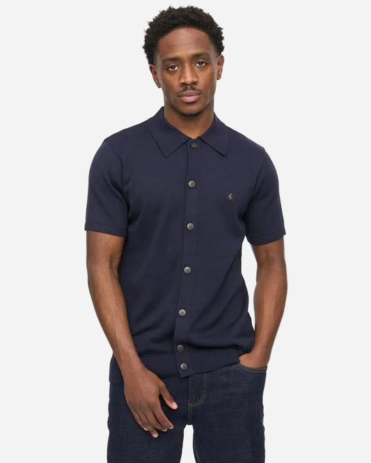 Gabicci GUINESS Button-Through Polo Navy worn by model, showcasing style and comfort with its classic design.