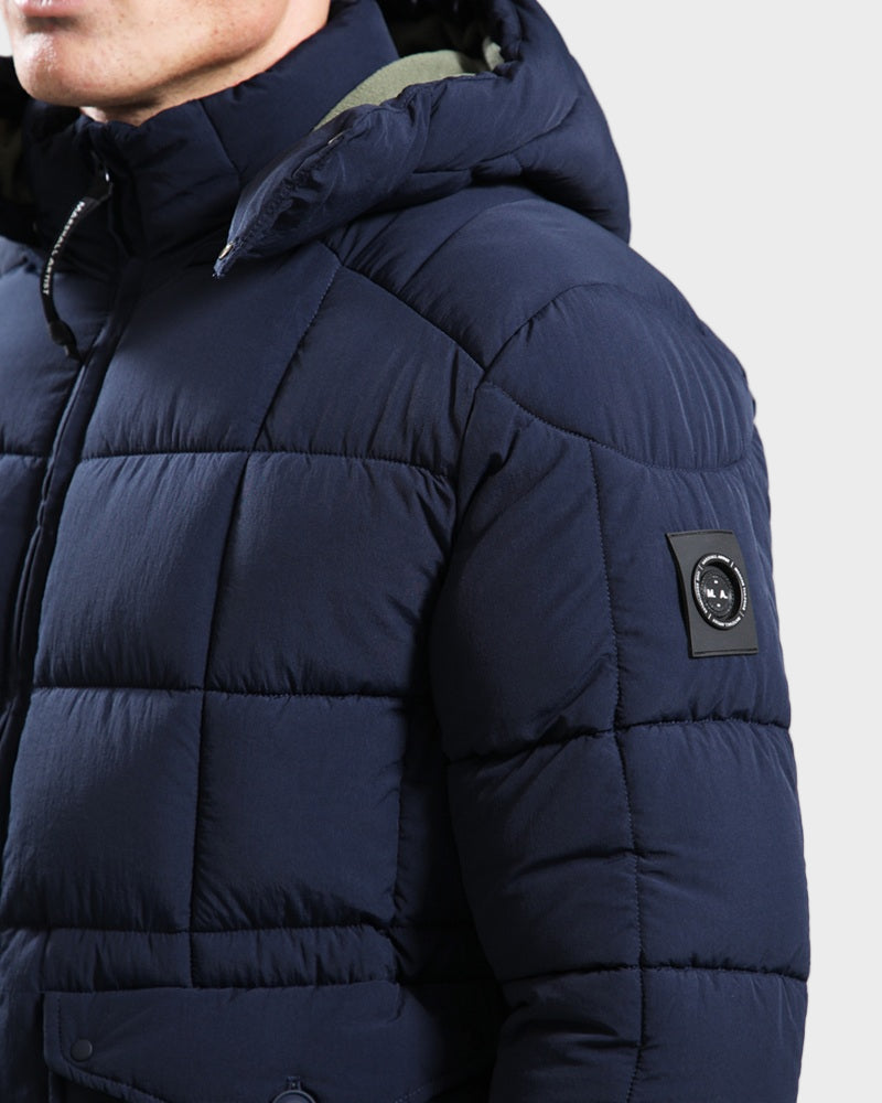 Marshall Artist YUKON Bubble Jacket Navy close-up side view showcasing the puffy design and detachable hood.