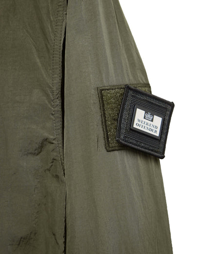 Close-up of Weekend Offender PORTER Overshirt in Castle Green showing branded patch on sleeve.